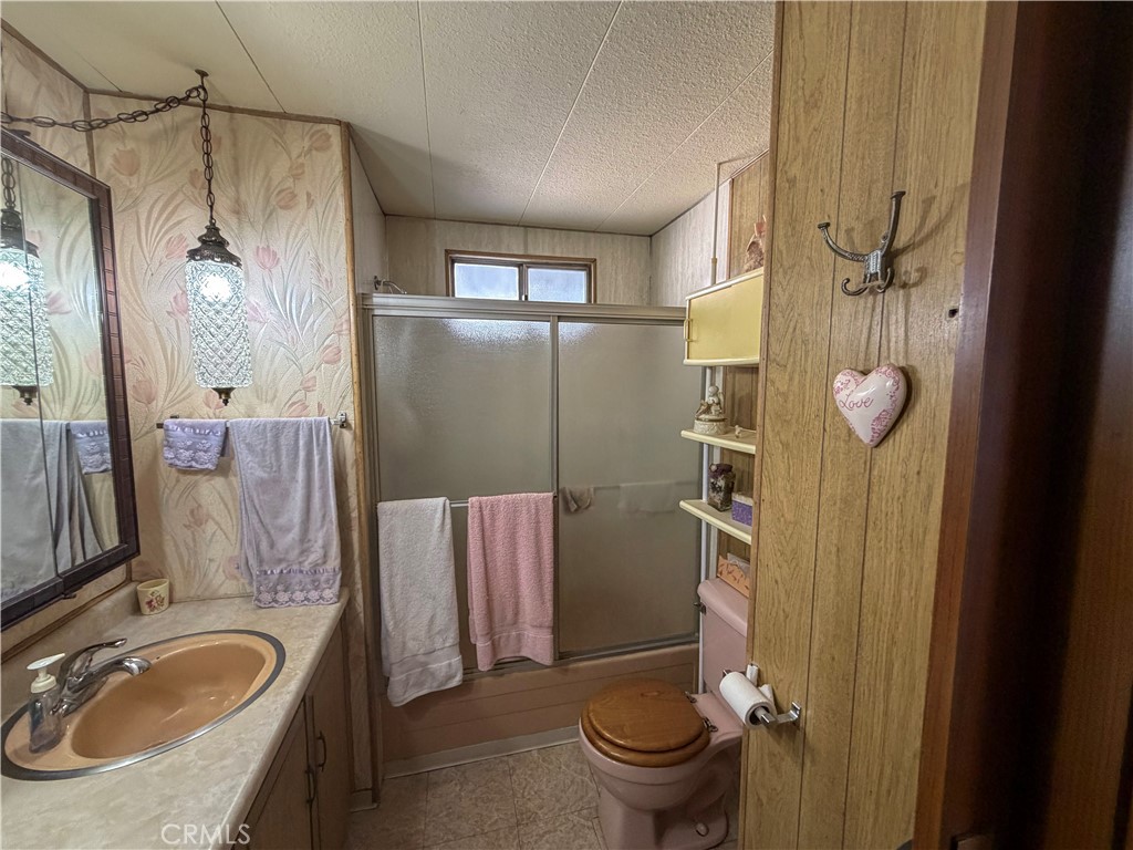 3701 Fillmore Street, Unit 64 Riverside, CA 92505 - Photo 25 of 26 a bathroom with a sink a toilet and shower