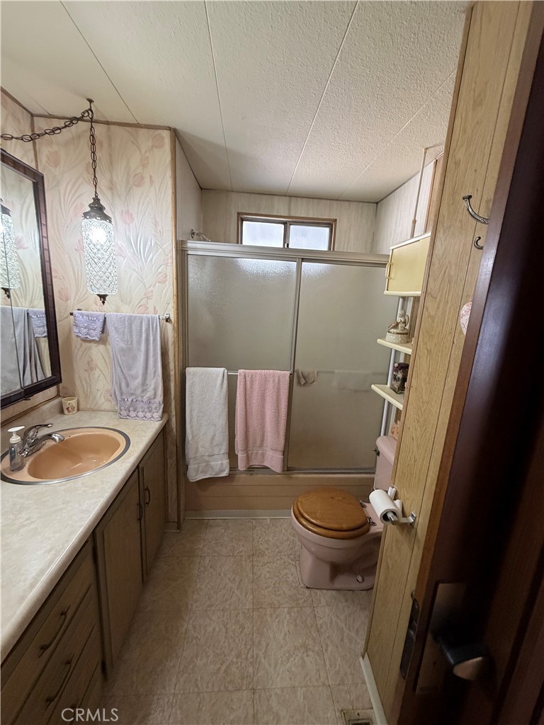 3701 Fillmore Street, Unit 64 Riverside, CA 92505 - Photo 26 of 26 a bathroom with a sink toilet and shower