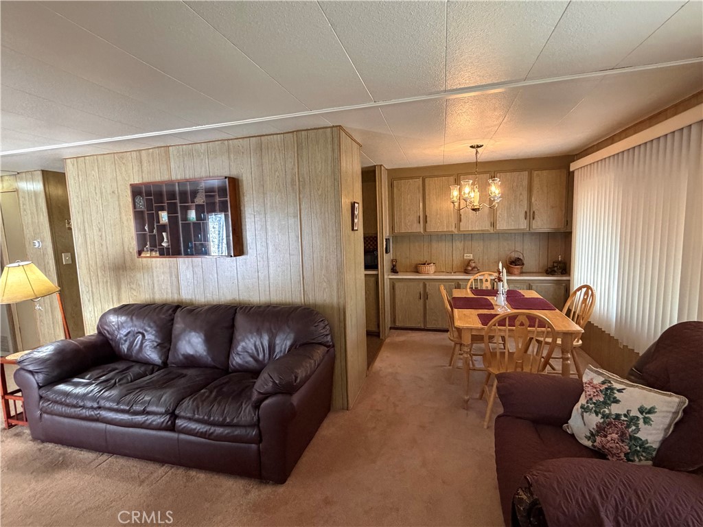 3701 Fillmore Street, Unit 64 Riverside, CA 92505 - Photo 5 of 26 a living room with furniture and a window