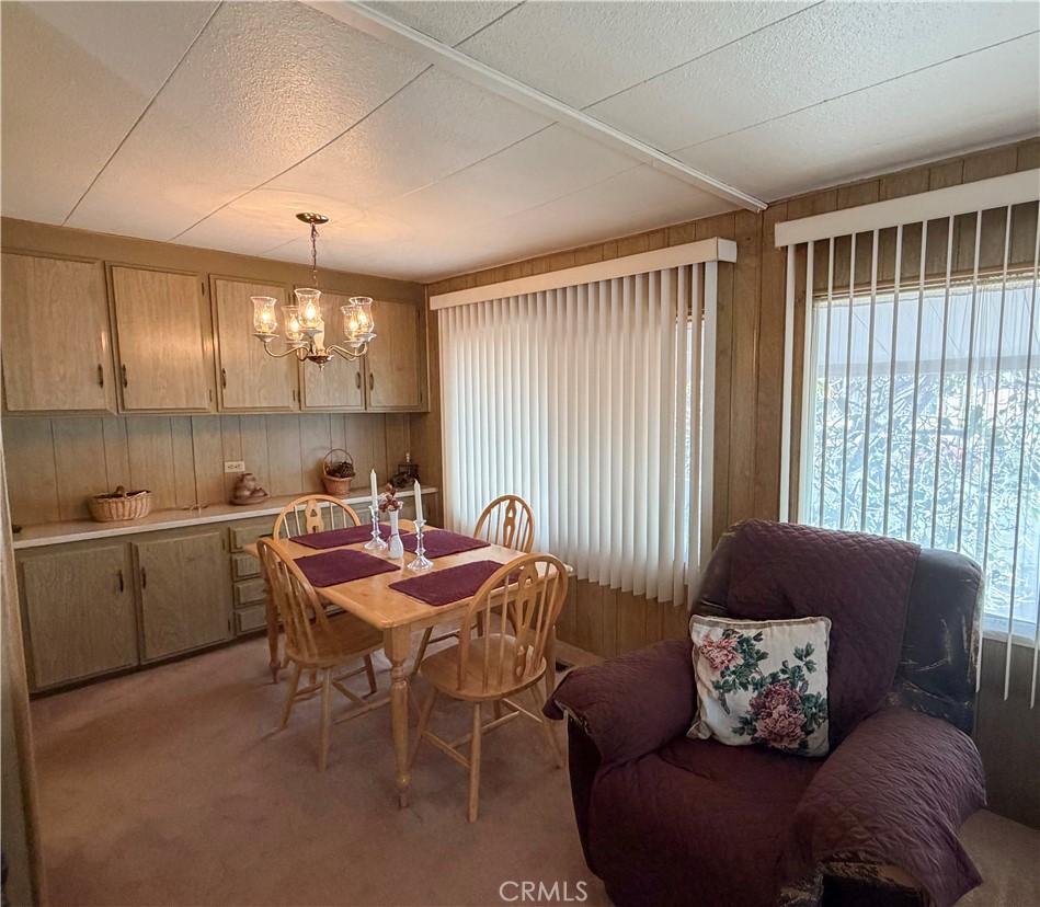 3701 Fillmore Street, Unit 64 Riverside, CA 92505 - Photo 6 of 26 a living room with furniture and a window