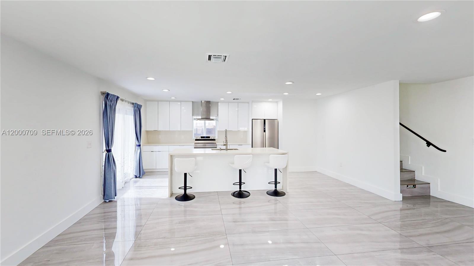 1886 Northwest 68th Street Miami, FL 33147 - Photo 11 of 56 a view of kitchen with wooden floor
