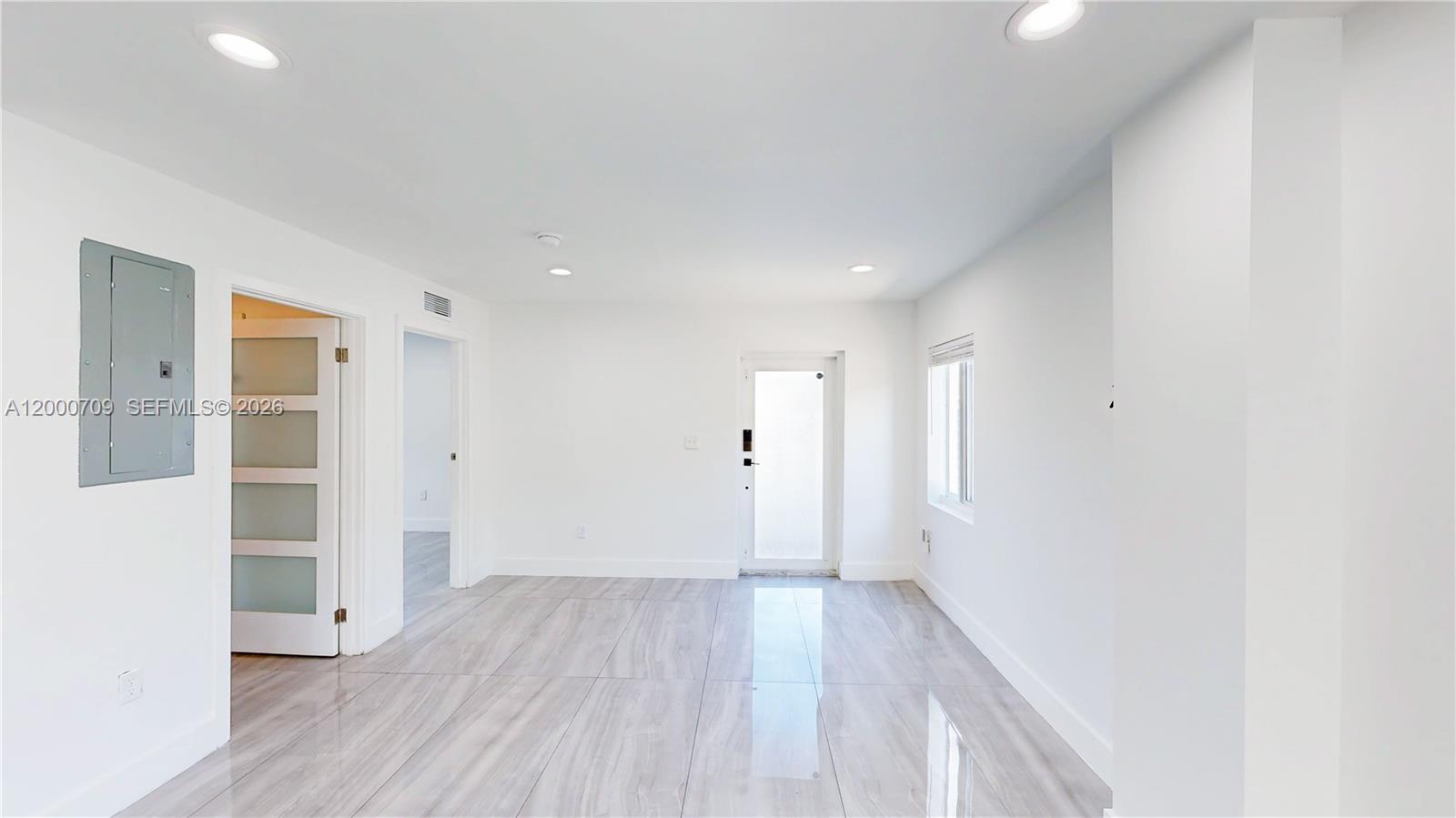1886 Northwest 68th Street Miami, FL 33147 - Photo 16 of 56 a view of a hallway with wooden floor