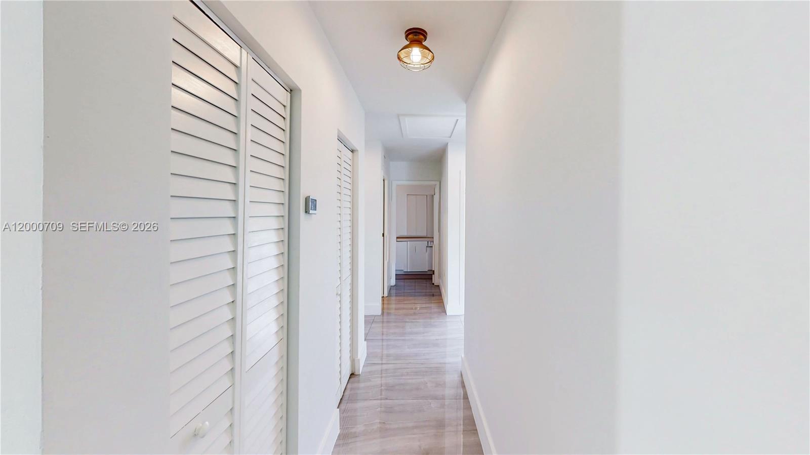 1886 Northwest 68th Street Miami, FL 33147 - Photo 22 of 56 a view of a bathroom from a hallway