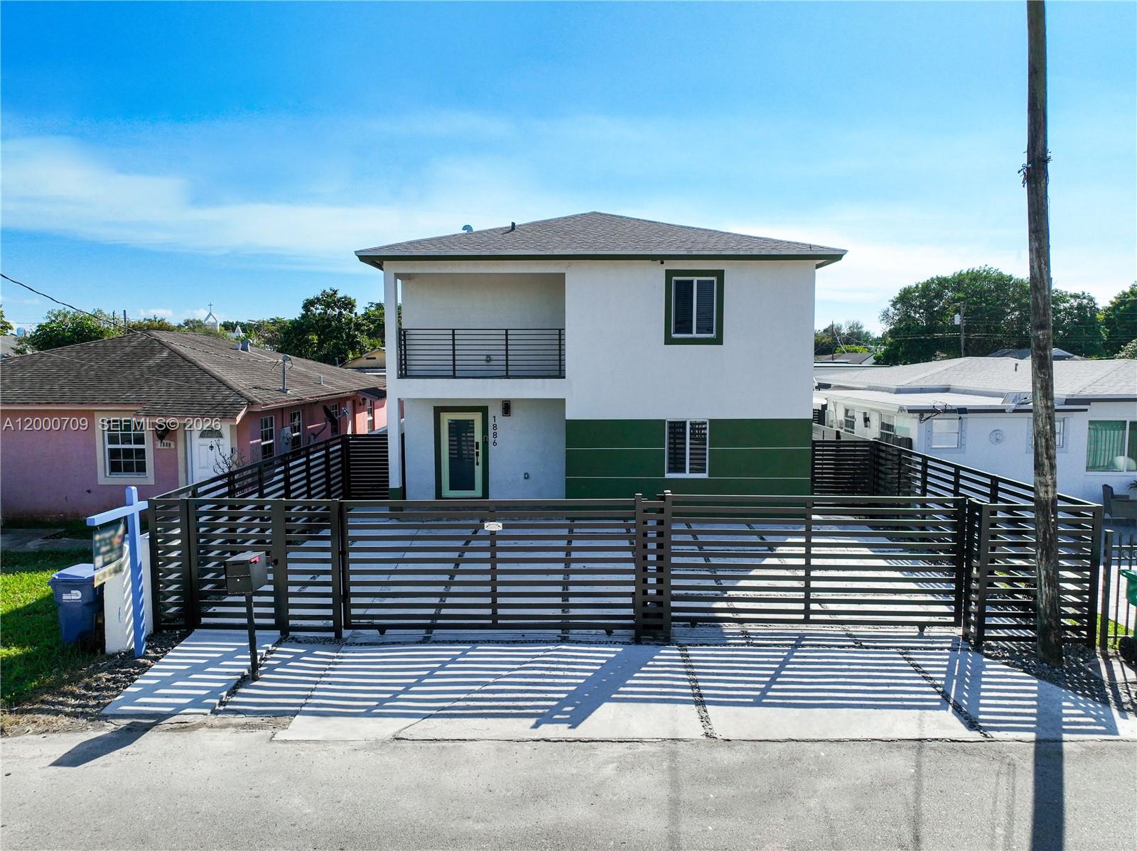 1886 Northwest 68th Street Miami, FL 33147 - Photo 48 of 56 a front view of a house with garage