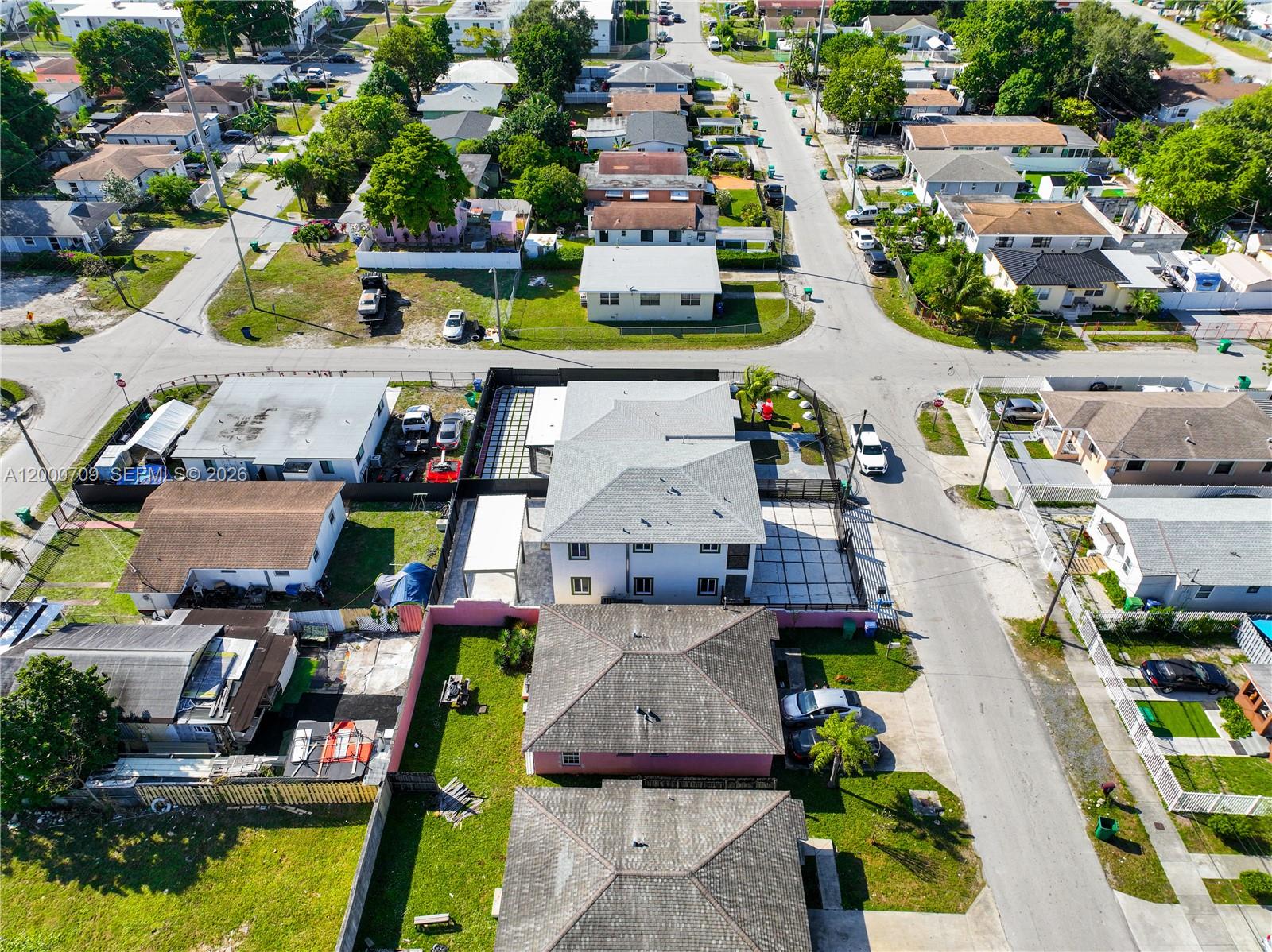 1886 Northwest 68th Street Miami, FL 33147 - Photo 56 of 56 an aerial view of residential houses with outdoor space