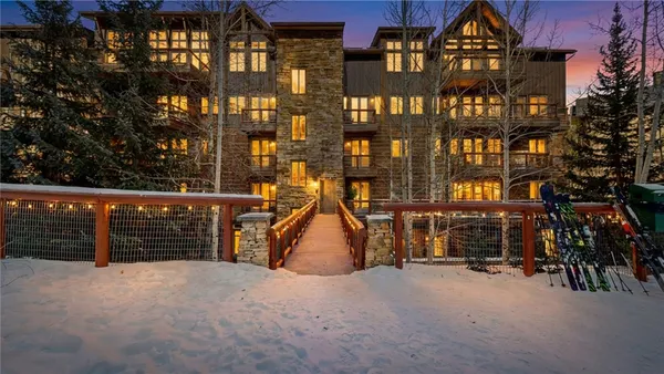 a view of a brick building with many windows