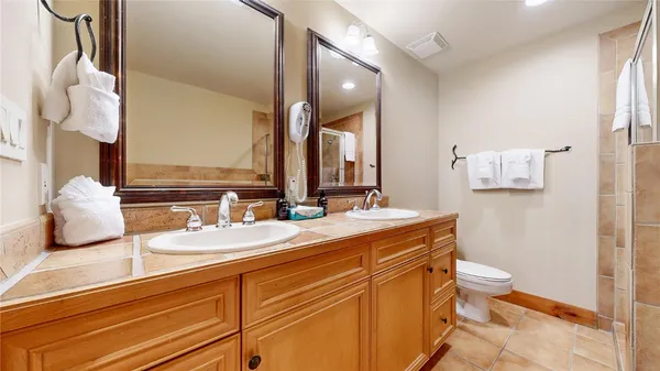 a bathroom with a glass shower door
