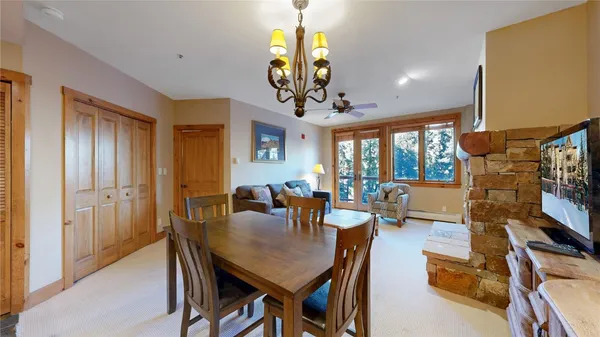 a living room with fireplace furniture and a wooden floor
