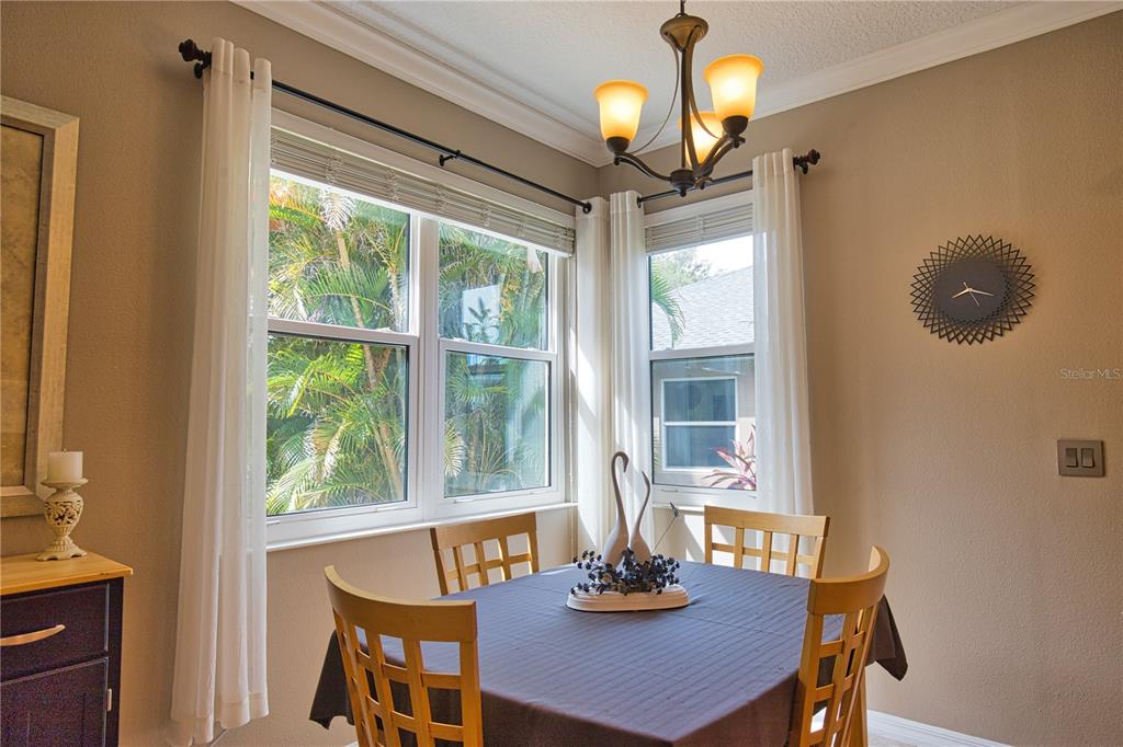 5288 Layton Drive Venice, FL 34293 - Photo 17 of 75 a view of a dining room with furniture window and outside view