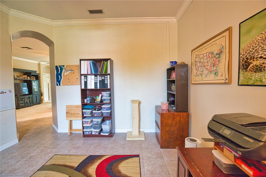 5288 Layton Drive Venice, FL 34293 - Photo 30 of 75 a living room with furniture and painting on the wall