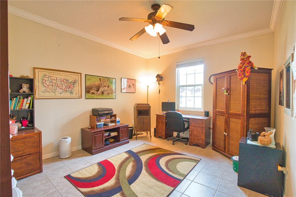 5288 Layton Drive Venice, FL 34293 - Photo 31 of 75 a living room with furniture and a flat screen tv
