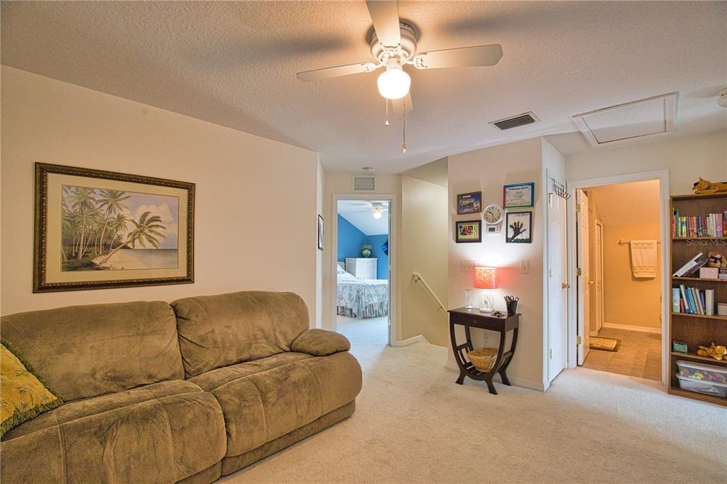 5288 Layton Drive Venice, FL 34293 - Photo 43 of 75 a living room with furniture and a painting
