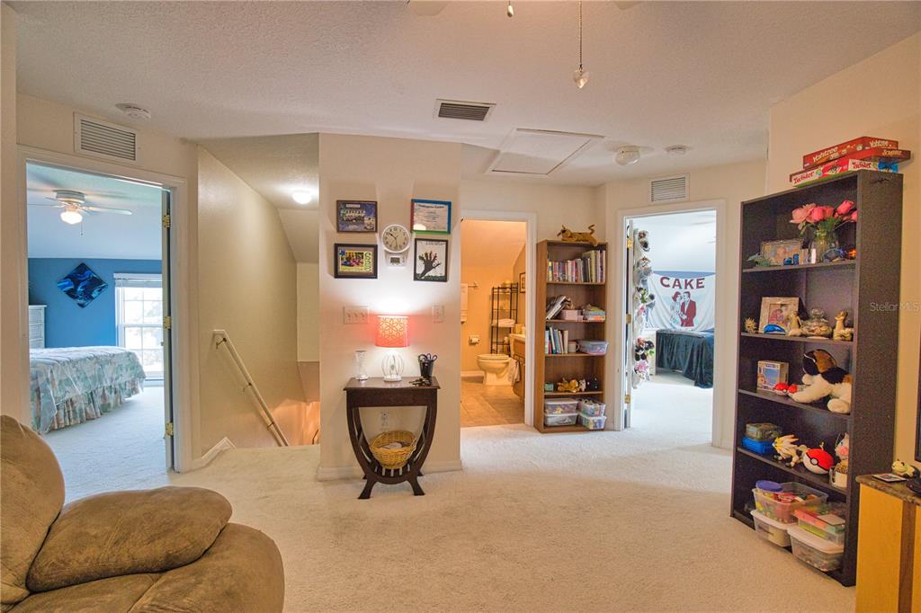 5288 Layton Drive Venice, FL 34293 - Photo 44 of 75 a living room with lots of furniture and a flat screen tv