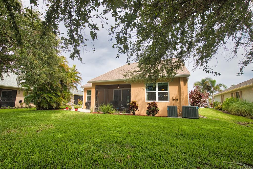 5288 Layton Drive Venice, FL 34293 - Photo 63 of 75 a front view of house with a garden and patio