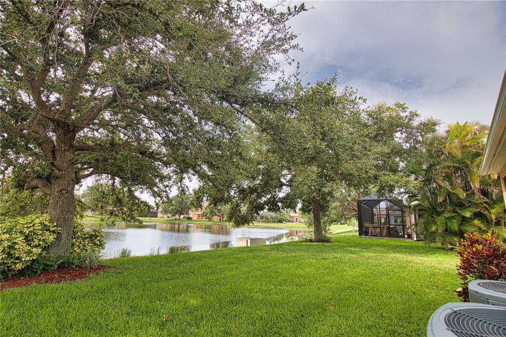 5288 Layton Drive Venice, FL 34293 - Photo 66 of 75 a view of yard with swimming pool and green space