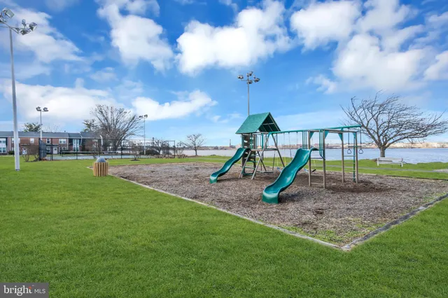 a view of yard with swimming pool and green space