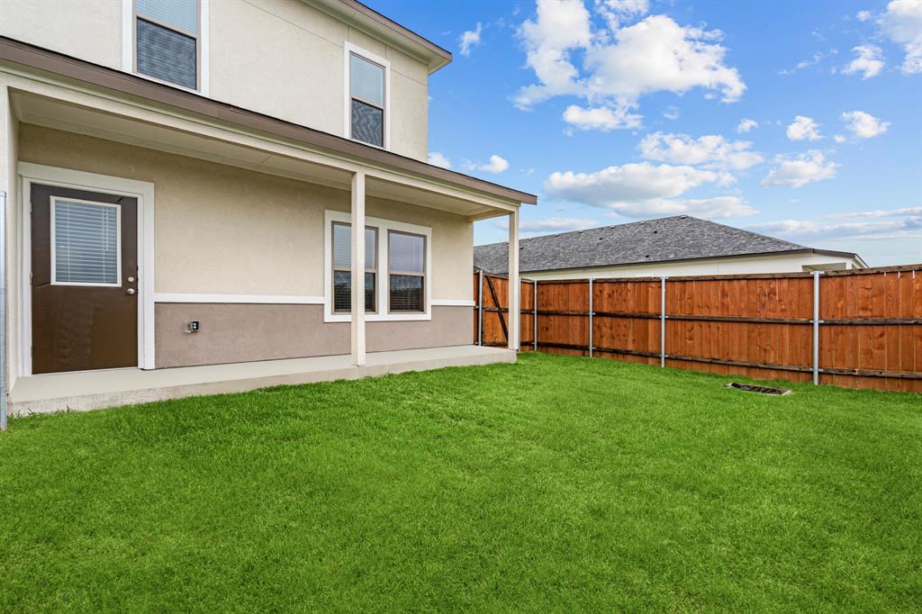 3281 Ganzer Road West, Unit 817A Denton, TX 76207 - Photo 18 of 40 a view of backyard with hardwood and deck
