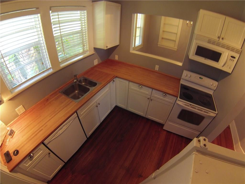 1719 Adams Street Hollywood, FL 33020 - Photo 13 of 29 a kitchen with sink cabinets and window