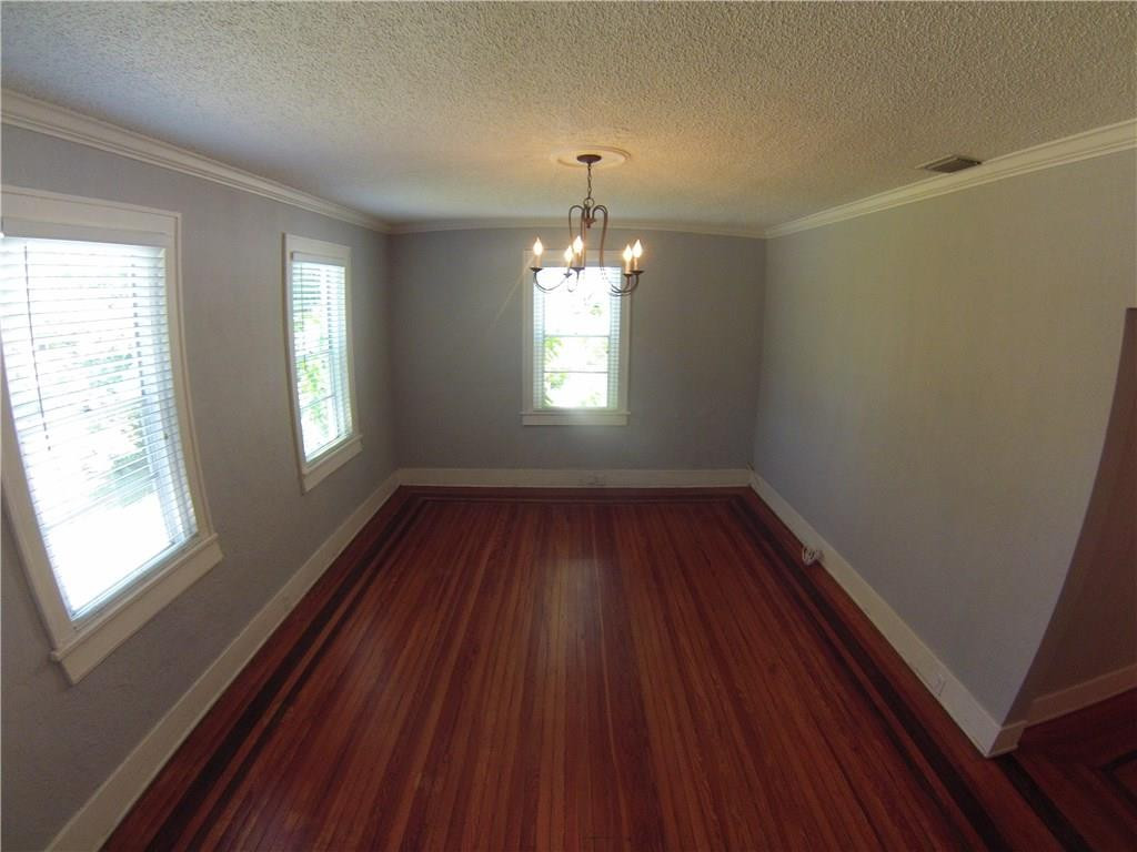 1719 Adams Street Hollywood, FL 33020 - Photo 2 of 29 an empty room with wooden floor and windows