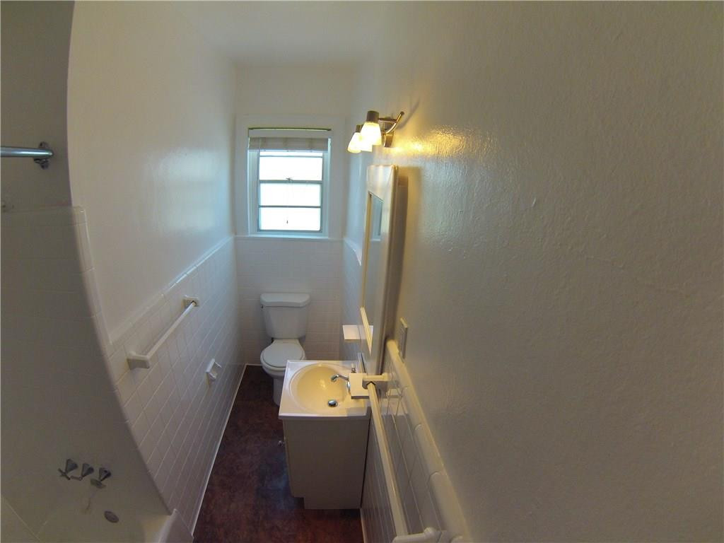 1719 Adams Street Hollywood, FL 33020 - Photo 22 of 29 a bathroom with a toilet and a shower