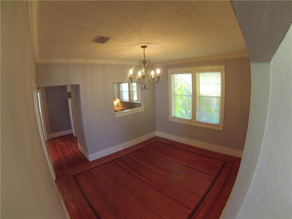 1719 Adams Street Hollywood, FL 33020 - Photo 4 of 29 a view of an empty room with wooden floor and a window