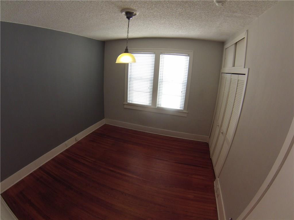 1719 Adams Street Hollywood, FL 33020 - Photo 6 of 29 an empty room with wooden floor and windows