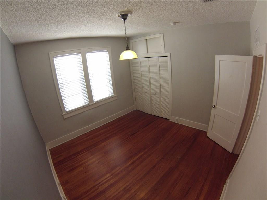 1719 Adams Street Hollywood, FL 33020 - Photo 7 of 29 a view of empty room with wooden floor and fan
