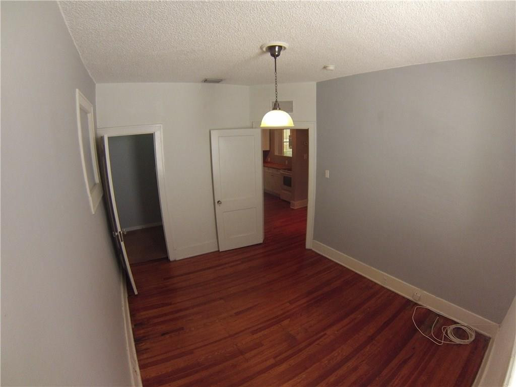 1719 Adams Street Hollywood, FL 33020 - Photo 9 of 29 an empty room with wooden floor and windows