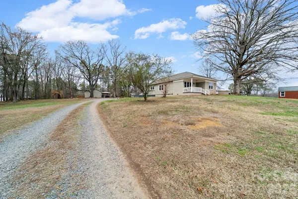 a big house with trees in front of it