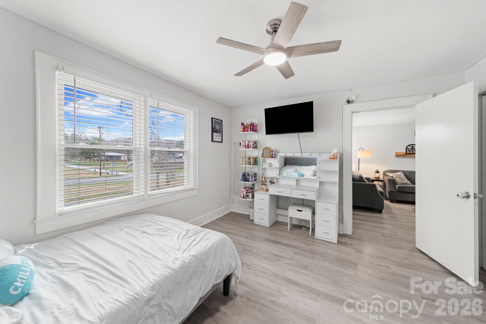 36141 Palestine Road Albemarle, NC 28001 - Photo 17 of 40 a bedroom with a bed a window and a television