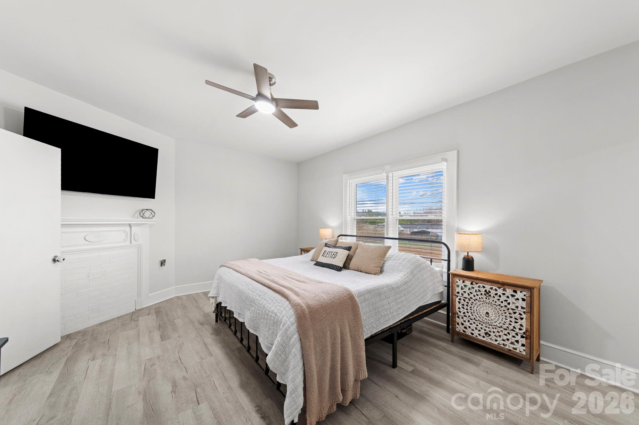 36141 Palestine Road Albemarle, NC 28001 - Photo 20 of 40 a bedroom with a bed and a flat screen tv