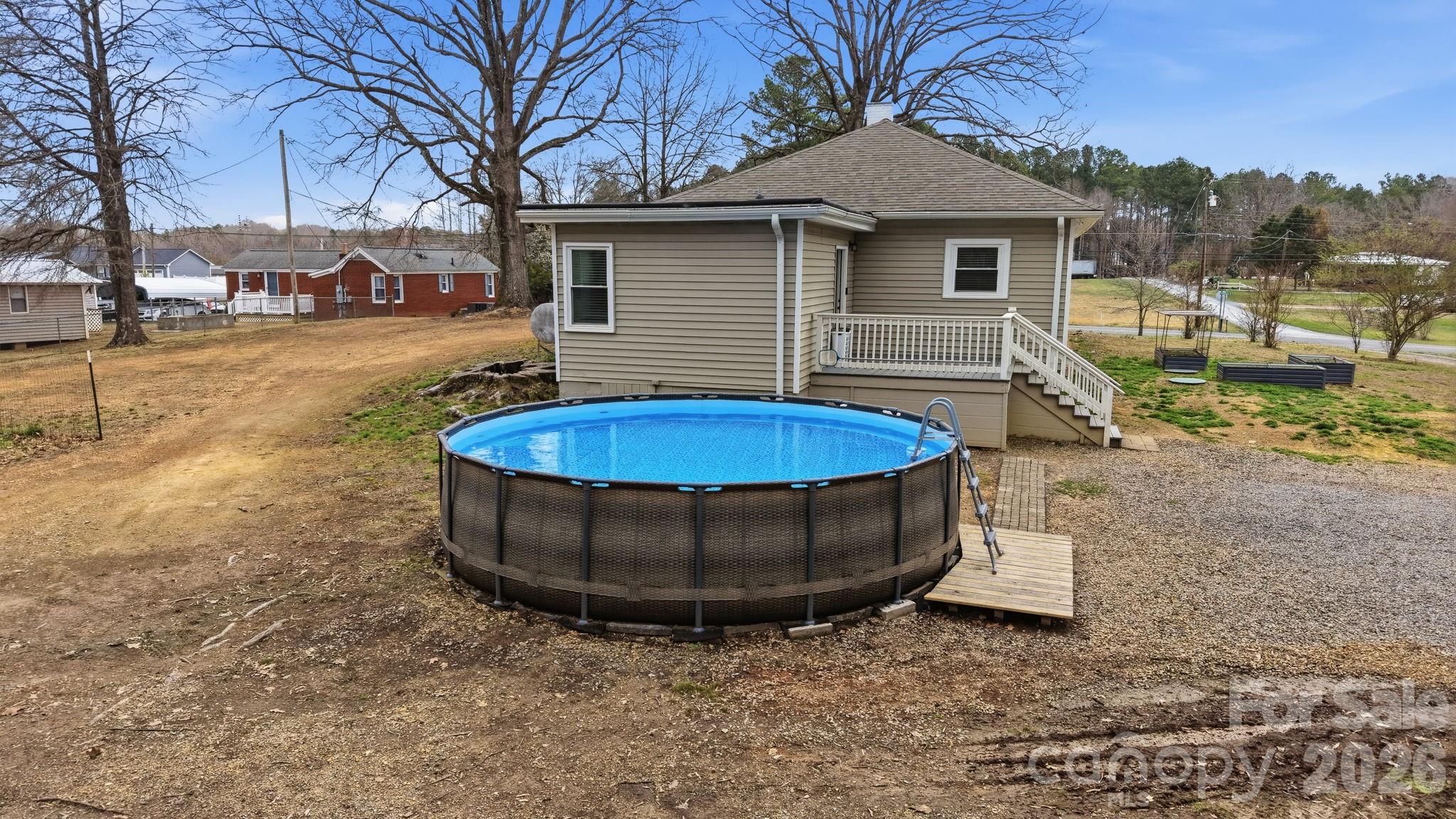 36141 Palestine Road Albemarle, NC 28001 - Photo 32 of 40 a view of a white house with a sink and yard