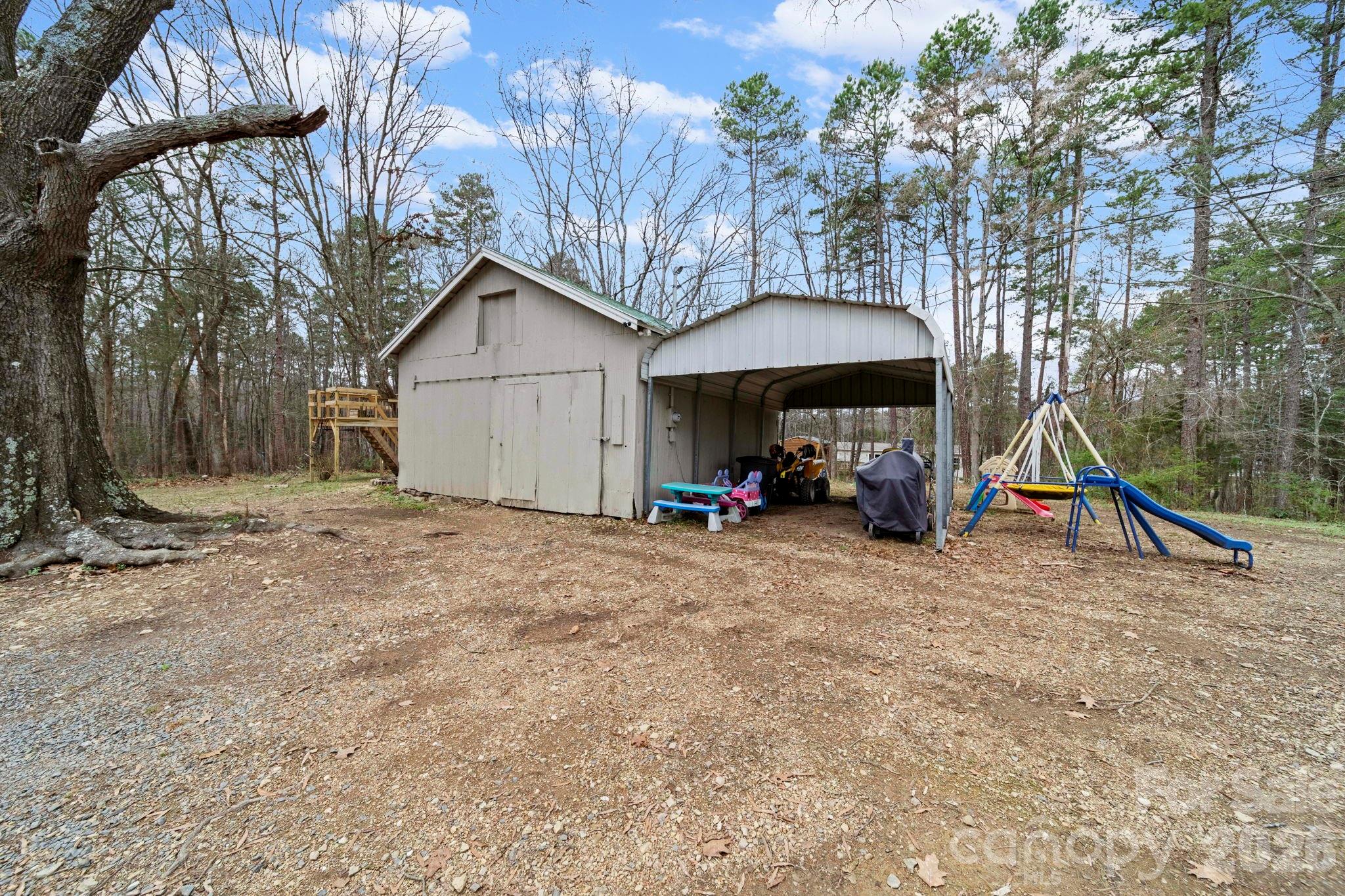 36141 Palestine Road Albemarle, NC 28001 - Photo 33 of 40 a view of outdoor space with playground and green space