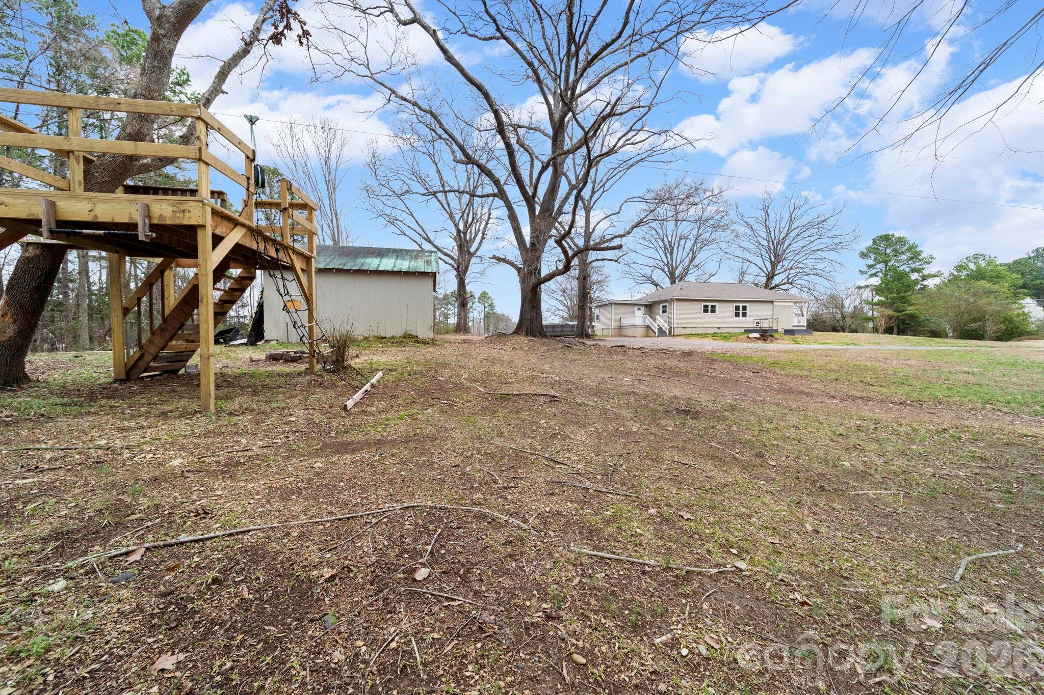 36141 Palestine Road Albemarle, NC 28001 - Photo 34 of 40 a view of a yard with brick wall