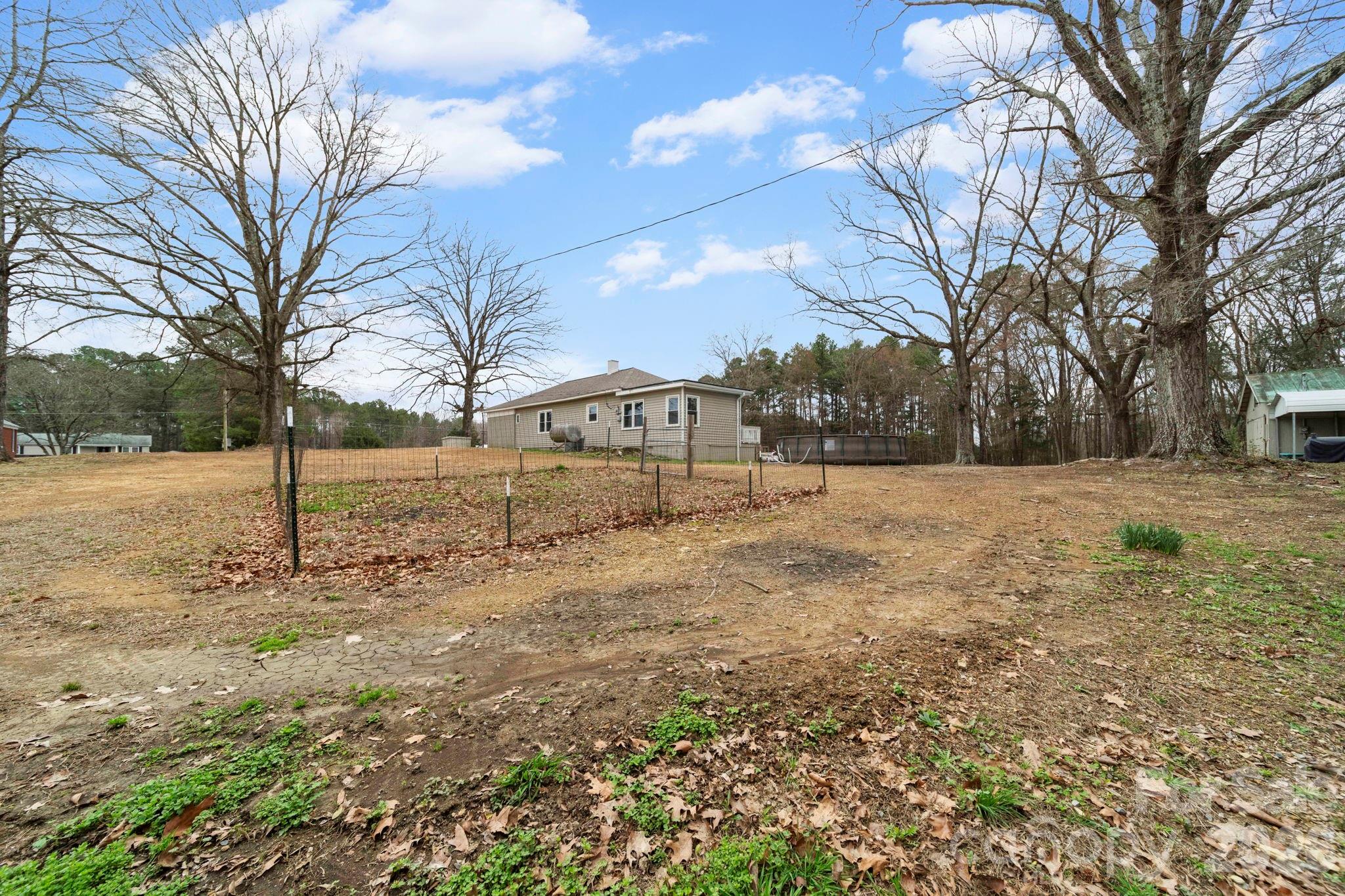 36141 Palestine Road Albemarle, NC 28001 - Photo 36 of 40 a view of white house with a yard