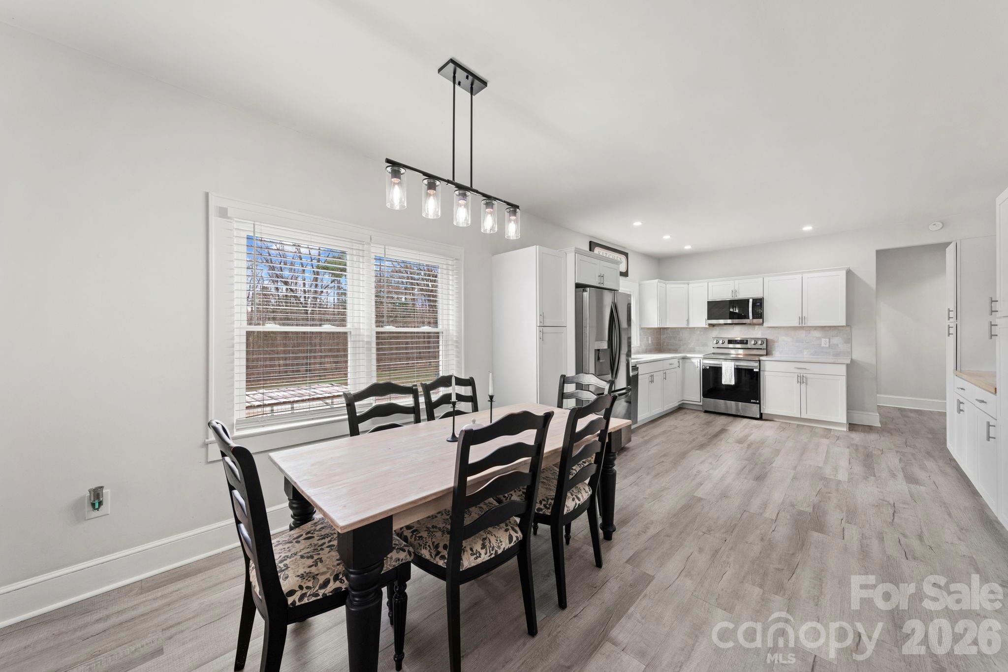 36141 Palestine Road Albemarle, NC 28001 - Photo 6 of 40 a view of a dining room with furniture window and wooden floor