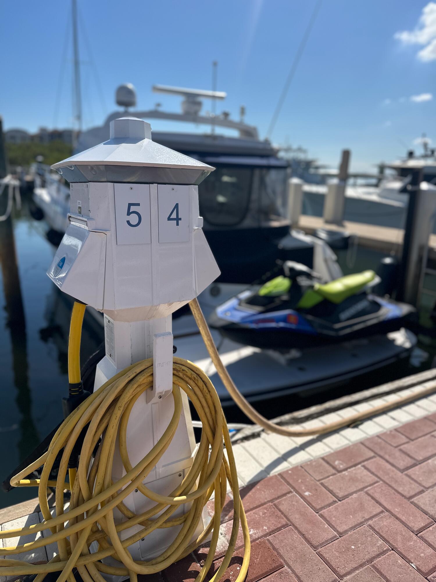 348 Highway 1, Unit 4 Jupiter, FL 33477 - Photo 5 of 6 a roof deck with table and chairs