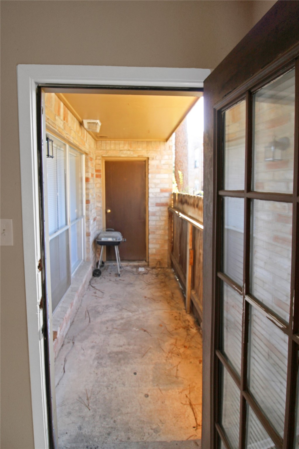 16303 Lyons School Road, Unit 313 Spring, TX 77379 - Photo 12 of 15 a view of a hallway with furniture and a refrigerator