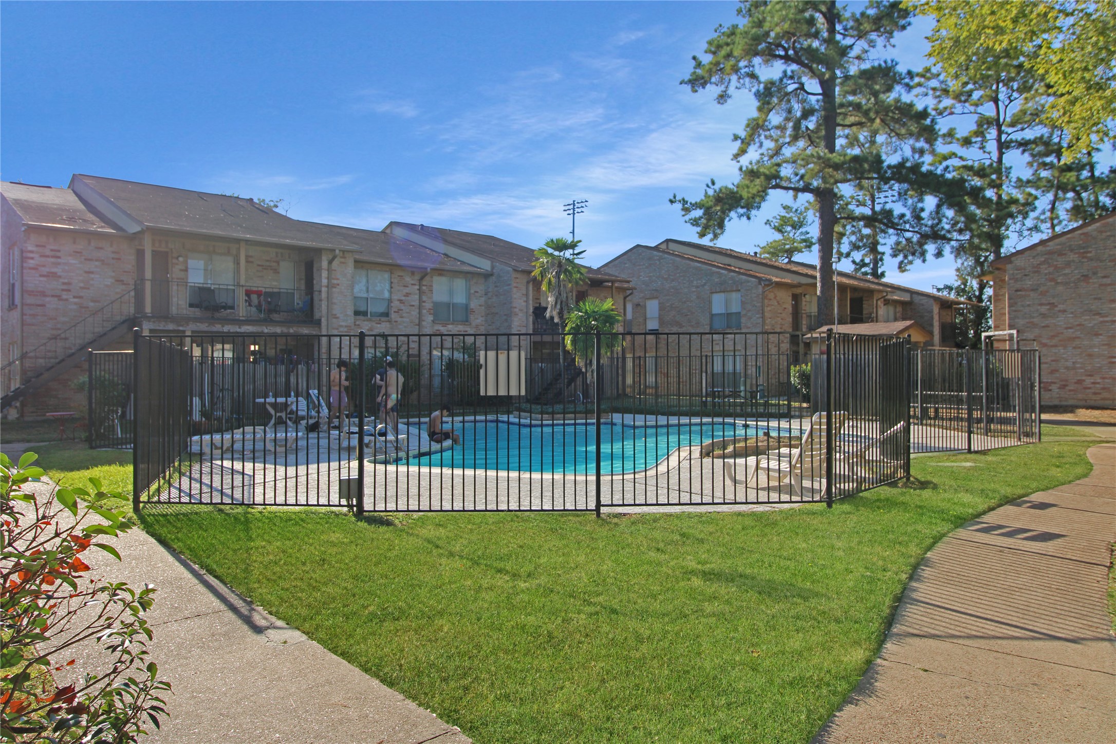 16303 Lyons School Road, Unit 313 Spring, TX 77379 - Photo 14 of 15 a view of a garden with a small yard and wooden fence