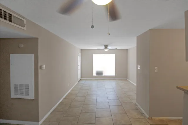 a view of hallway with natural light