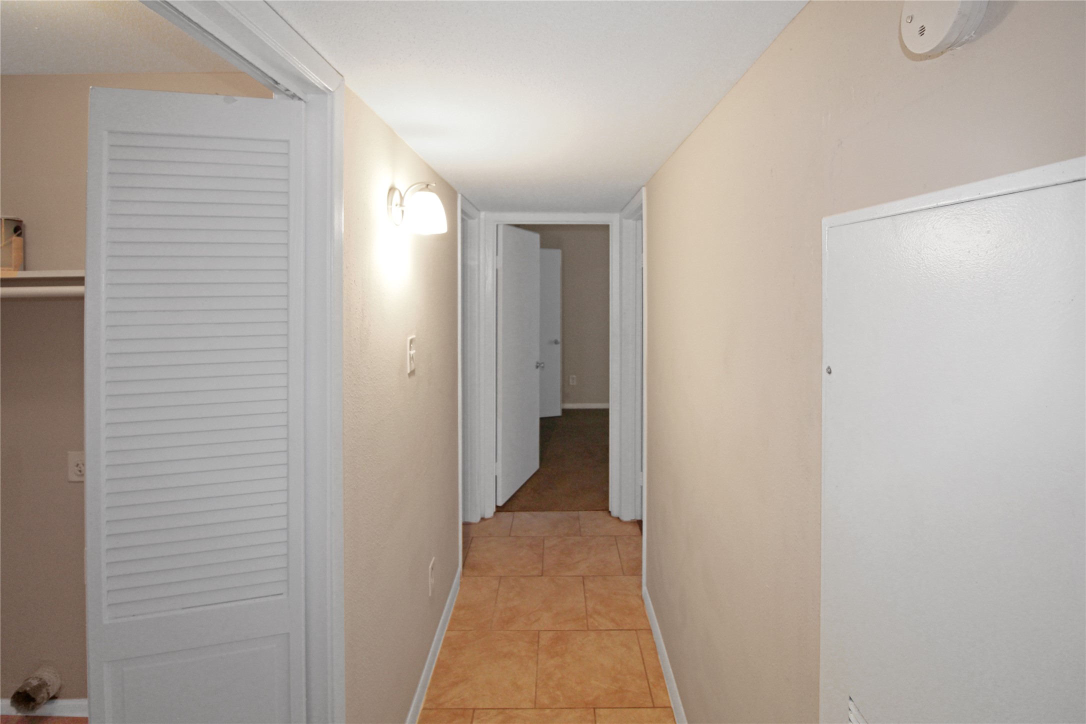 16303 Lyons School Road, Unit 313 Spring, TX 77379 - Photo 6 of 15 a view of a hallway