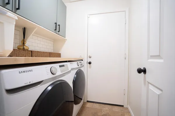 a utility room with dryer and washer