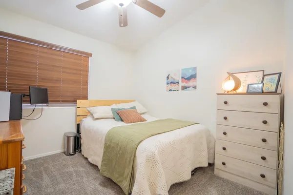 a bedroom with a bed and a cabinets