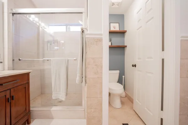 a bathroom with a shower and toilet