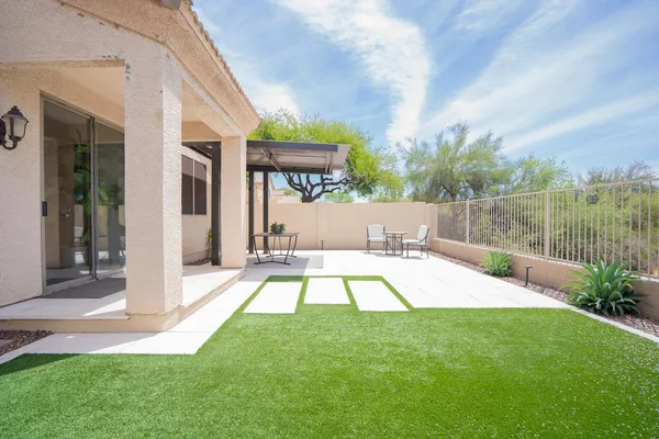 a view of a swimming pool with a patio