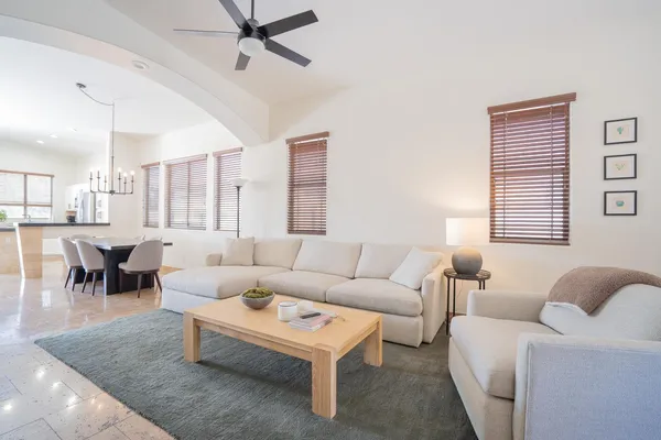 a living room with furniture and a large window