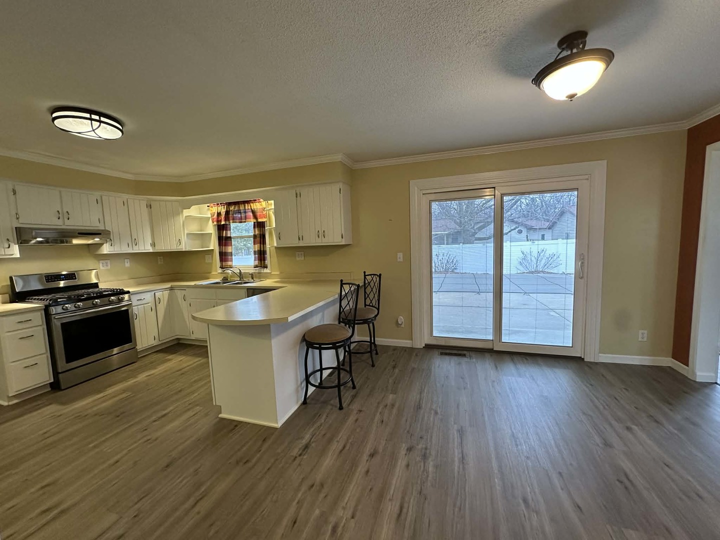 11 Kennedy Court Philo, IL 61864 - Photo 11 of 35 a kitchen with a sink and wooden floor