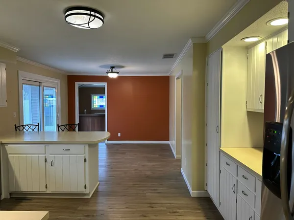 a view of a kitchen from the hallway
