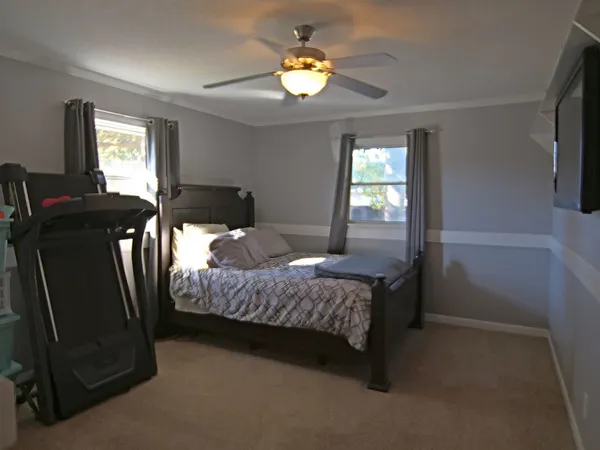 a bedroom with a bed and window
