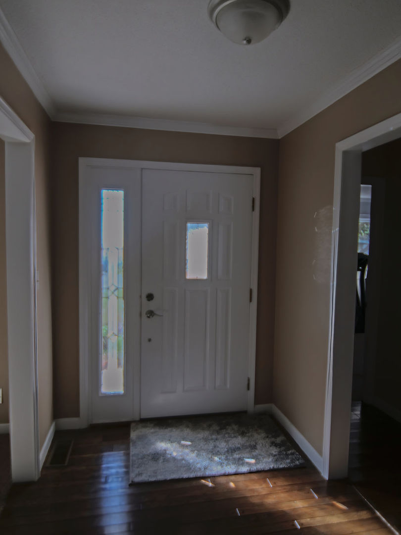 11 Kennedy Court Philo, IL 61864 - Photo 3 of 35 a view of an empty room and wooden floor